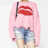 <tc>Women’s Oversized Sweater™ | Chunky Knit with Lips Print and Fringed Hem</tc>