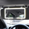 Touchscreen mirror with car light adjustment